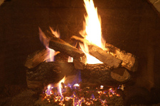 What is better a vented-gas log or a vent-free gas log fireplace?