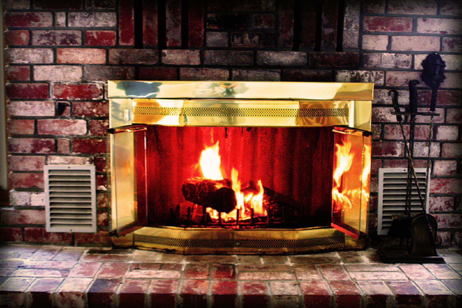 Replace the fireplace glass door and fix the damper, or use a Chimney Balloon?